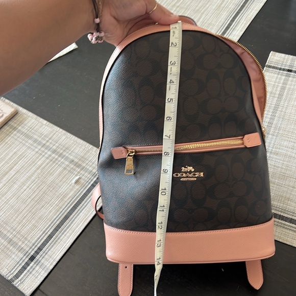 coach backpack brown and pink Mini Court Colorblock Leather Small Bag Red Orange Luxe Fashion Finds Refined pebble leather Inside zip and multifunction pockets Zip closure fabric lining Top handle with 2 1/2 drop Outside zip pocket Adjustable shoulder straps 12 (L) x 14 3/4 (H) x 5 (W) Style No. Coach Coach Leather Switch Signature
